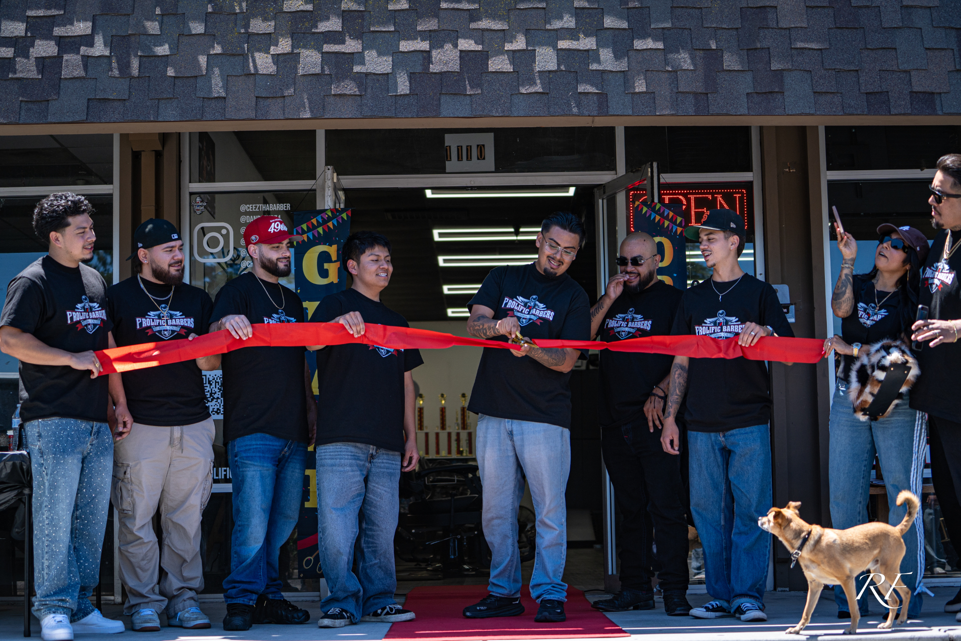 Prolific Barbers team grand opening ribbon cutting